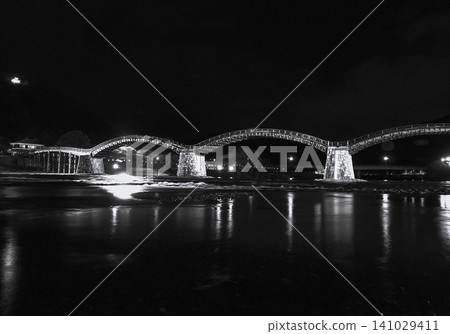 Kintaikyo Bridge at night: The beautiful monochrome five arches and their reflections on the river surface. Kintaikyo Bridge at night: The beautiful monochrome five arches and their reflections on the river surface. 141029411