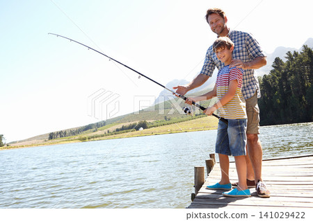 Father, child and fishing in a nature portrait for learning, teaching and outdoor with holiday, travel or sustainable living. Happy family, dad and boy or kid with rod by water or lake for camping Father, child and fishing in a nature portrait for learning, teaching and outdoor with holiday, travel or sustainable living. Happy family, dad and boy or kid with rod by water or lake for camping 141029422