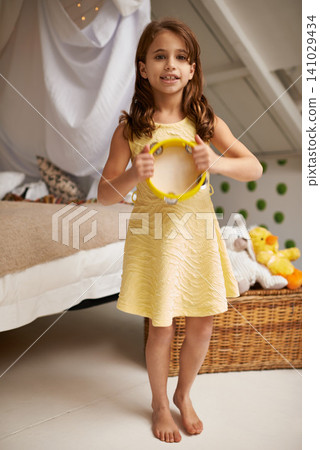 Child, smile and portrait with tambourine in bedroom for instrument, play and music with joy for fun and activity. Young girl or kid and happy with fun for enjoy, game and sound for childhood Child, smile and portrait with tambourine in bedroom for instrument, play and music with joy for fun and activity. Young girl or kid and happy with fun for enjoy, game and sound for childhood 141029434