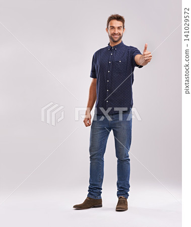 Young man, portrait and thumbs up in studio for thank you, approval and promotion by grey background. Entrepreneur, smile or face for positive review in satisfaction or agreement hand sign in mockup Young man, portrait and thumbs up in studio for thank you, approval and promotion by grey background. Entrepreneur, smile or face for positive review in satisfaction or agreement hand sign in mockup 141029572