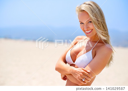 Woman, beach and portrait on sand vacation, travel and calm satisfaction for peace and ocean. Happy female person, smile and bikini for holiday to sea on weekend, nature and relax on tropical island Woman, beach and portrait on sand vacation, travel and calm satisfaction for peace and ocean. Happy female person, smile and bikini for holiday to sea on weekend, nature and relax on tropical island 141029587