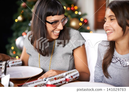 Family, Christmas and mom with daughter at lunch for festive bonding and eating together in home. Holiday, celebration and happy people at table with food, drinks and xmas dinner tradition with smile 141029783