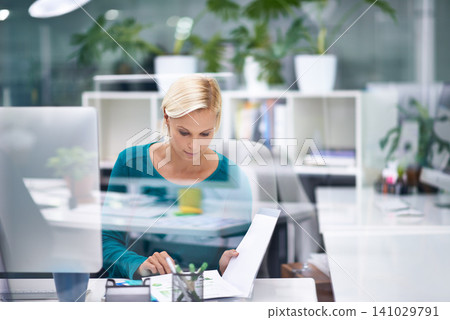 Woman, reading and thinking with documents in office for decision, review or feedback for proposal at startup. Business person, paperwork and ideas with choice, solution or creativity at media agency 141029791
