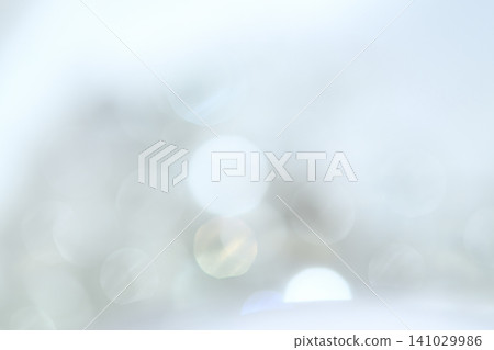 A soft, pale blue bokeh effect against an abstract background with ample negative space. A soft, pale blue bokeh effect against an abstract background with ample negative space. 141029986