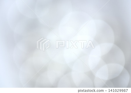 A soft, pale blue bokeh effect against an abstract background with ample negative space. A soft, pale blue bokeh effect against an abstract background with ample negative space. 141029987