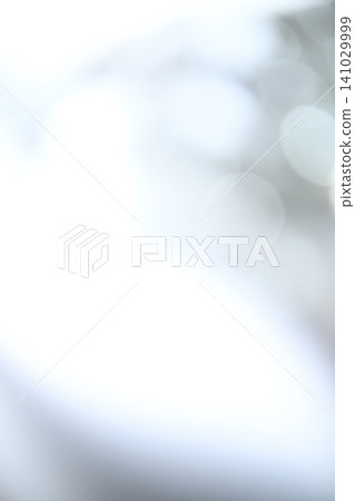 A soft, pale blue bokeh effect against an abstract background with ample negative space. A soft, pale blue bokeh effect against an abstract background with ample negative space. 141029999