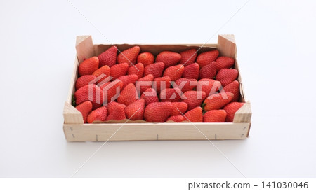strawberries in a wooden box fresh strawberries in wooden boxes on fields background strawberries in a wooden box fresh strawberries in wooden boxes on fields background 141030046
