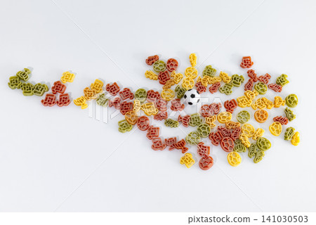 Colorful pasta pieces with football themed shapes outlining the silhouette of Austria, creating playful football themed food art. Colorful pasta pieces with football themed shapes outlining the silhouette of Austria, creating playful football themed food art. 141030503