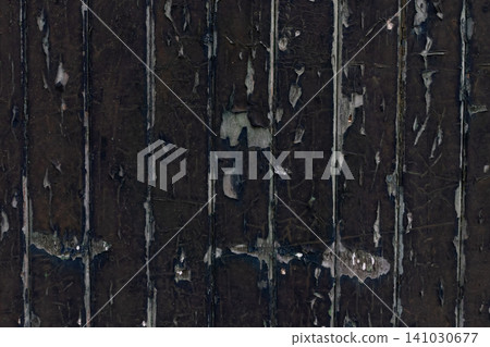 Texture of old vertical weathered wooden planks with cracked and peeling dark paint as background Texture of old vertical weathered wooden planks with cracked and peeling dark paint as background 141030677