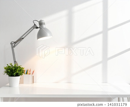 Minimalist desk workspace with lamp, potted plant, and colored pencils Minimalist desk workspace with lamp, potted plant, and colored pencils 141031179