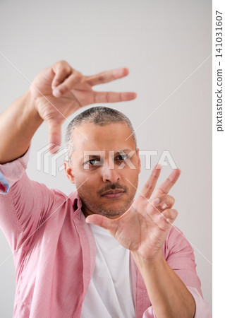 Mature Man Framing View with Hands Mature Man Framing View with Hands 141031607