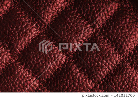 Macro of red quilted leather texture background with stitched pattern and shining metal effect Macro of red quilted leather texture background with stitched pattern and shining metal effect 141031700