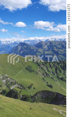 Panoramic mountain ridges and green slopes in the Swiss Alps near Stockhorn Panoramic mountain ridges and green slopes in the Swiss Alps near Stockhorn 141031875