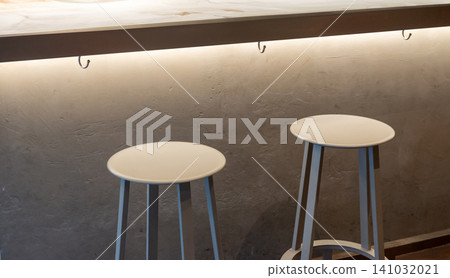 A stylish cafe-bar with counter seating and modern stools lined up inside. A stylish cafe-bar with counter seating and modern stools lined up inside. 141032021