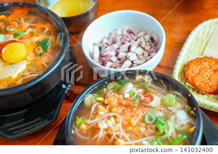 Kongnamul Gukbap Traditional Korean meal with sprout soup and mung bean pancake Kongnamul Gukbap Traditional Korean meal with sprout soup and mung bean pancake 141032400