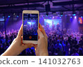 Blurred out-of-focus crowded live concert inside a club 141032763