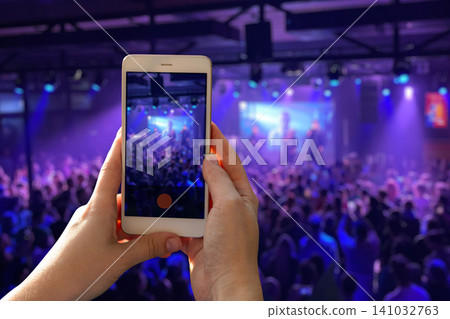 Blurred out-of-focus crowded live concert inside a club Blurred out-of-focus crowded live concert inside a club 141032763