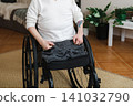 Amputee disabled person on the wheelchair 141032790