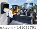 Electric construction machines with charging station. Concept. 141032791