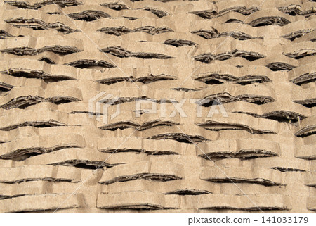 Kraft paper cut into strips as packaging material for fragile items Kraft paper cut into strips as packaging material for fragile items 141033179