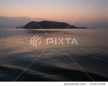 beautiful seascape on the horizon silhouette of mountains 141033260