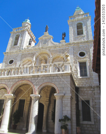 Facade of the Wedding Church in Cana with religious statues 141033303