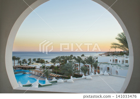 View of Domina Coral Bay Resort through a circular window in Sharm El Sheikh View of Domina Coral Bay Resort through a circular window in Sharm El Sheikh 141033476