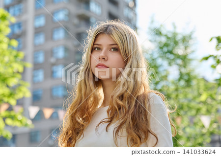 Portrait of 16 year old blonde teenage girl in city Portrait of 16 year old blonde teenage girl in city 141033624