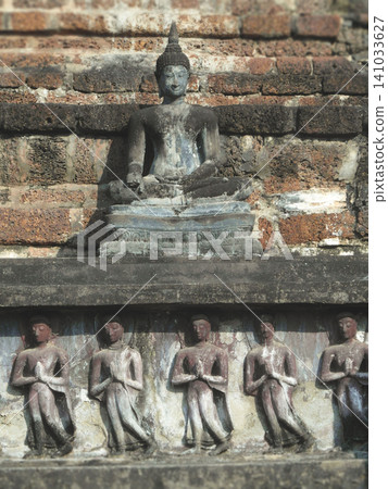 Title Ancient Buddha statue and stone reliefs at Wat Mahathat in Sukhothai Thailand 141033627