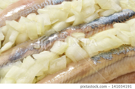 Dutch herring with onions close up. Traditional Dutch herring with onions as eaten in Amsterdam, close up . Dutch herring with onions close up. Traditional Dutch herring with onions as eaten in Amsterdam, close up . 141034191