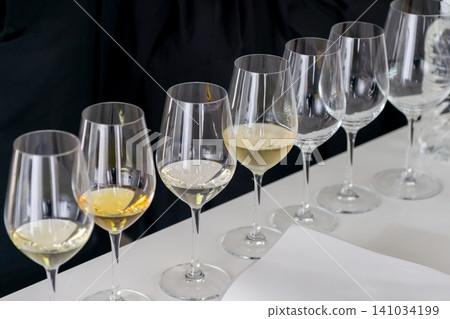 Wine tasting: Image of a glass and notepad. Wine tasting: Image of a glass and notepad. 141034199