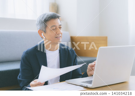 A man working on a computer A man working on a computer 141034218