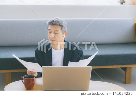 A man working on a computer A man working on a computer 141034223