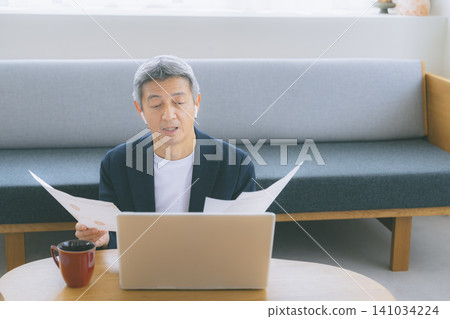 A man working on a computer 141034224