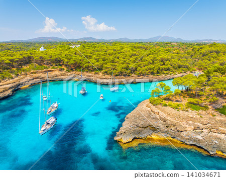 Aerial view of a sea bay and azure water in Mallorca, Spain. Aerial view of a sea bay and azure water in Mallorca, Spain. 141034671