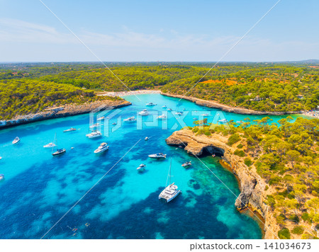 Aerial drone view of yachts and boats in Mediterranean sea bay. Aerial drone view of yachts and boats in Mediterranean sea bay. 141034673