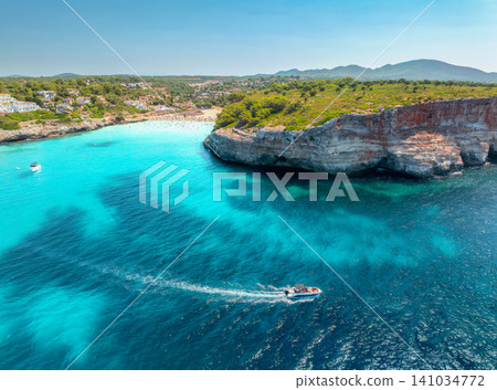Aerial view of motor boat near resort beach in Mallorca, Spain Aerial view of motor boat near resort beach in Mallorca, Spain 141034772