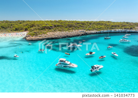 Aerial view of luxury yachts and boats in mediterranean sea bay Aerial view of luxury yachts and boats in mediterranean sea bay 141034773