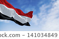 Yemen national flags waving on a clear day 141034849