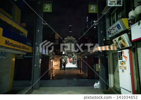 The quiet Asakusa Shin-Nakamise shopping street after closing time, with the Tokyo Skytree towering in the background. The quiet Asakusa Shin-Nakamise shopping street after closing time, with the Tokyo Skytree towering in the background. 141034852