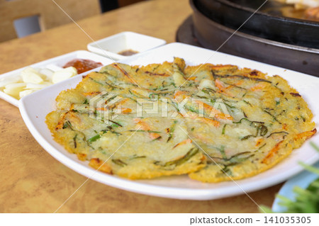 Crispy Pan Fried Traditional Korean Potato Pancake Gamjajeon 141035305