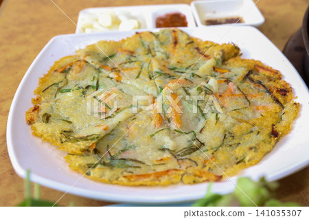 Crispy Pan Fried Traditional Korean Potato Pancake Gamjajeon Crispy Pan Fried Traditional Korean Potato Pancake Gamjajeon 141035307
