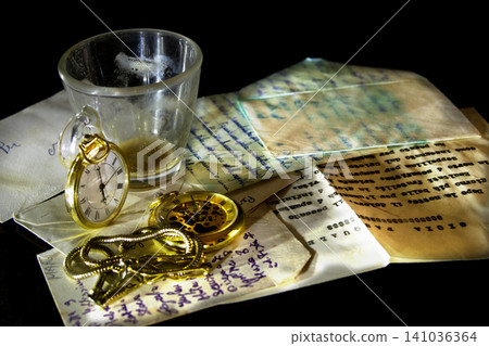 Antique letters with pocket watch and empty espresso cup Antique letters with pocket watch and empty espresso cup 141036364