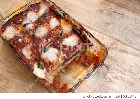 Eggplant parmigiana in glass baking dish Eggplant parmigiana in glass baking dish 141036373