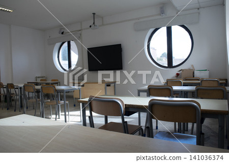 Empty classroom with desks and chairs Empty classroom with desks and chairs 141036374
