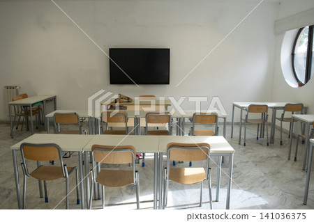 Empty classroom with modern desks and television 141036375