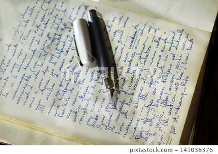 Fountain pen on handwritten notebook page Fountain pen on handwritten notebook page 141036376