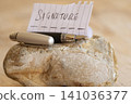 Fountain pen and signature paper on stone 141036377