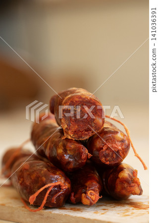 Calabrian Sausage Stacked on Wooden Board for Traditional Cuisine Calabrian Sausage Stacked on Wooden Board for Traditional Cuisine 141036391