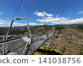 Arouca 516 suspension bridge crossing a dramatic valley in Portugal, showcasing modern engineering, adventure tourism, geometric design, scenic landscapes, and outdoor exploration 141038756